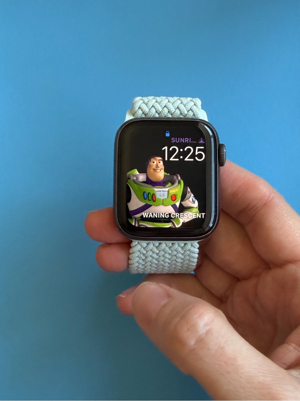 Apple Watch Series 4 with various wristbands and charger